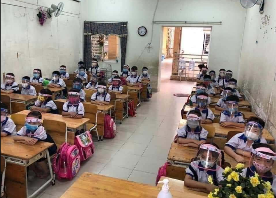 COVID-19 combat: Vietnamese students wear anti-droplet face shields returning school vietnamese students wear anti droplet face shields returning school