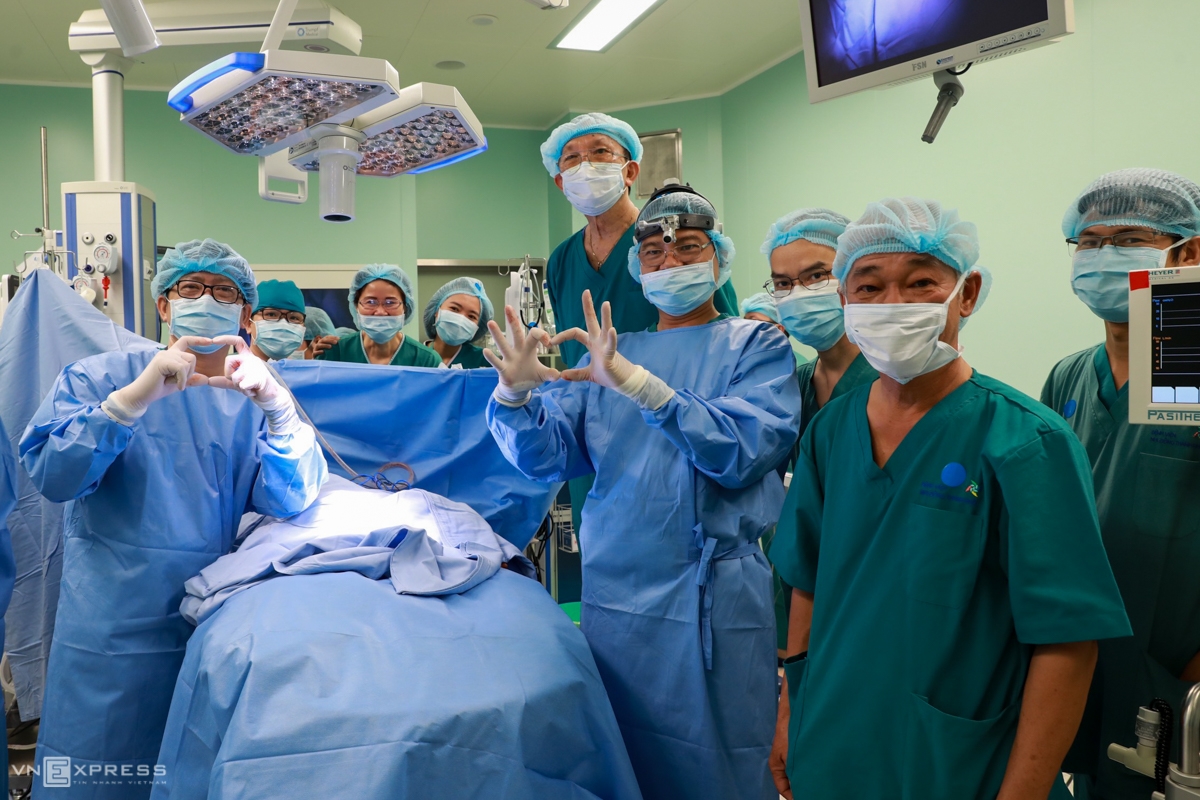 Nearly 100 doctors join in Vietnam’s most complicated co-joined twins separation The surgical team put on a bright smile after the surgery