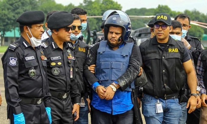 undefined Mohammad Shahed escorted by police