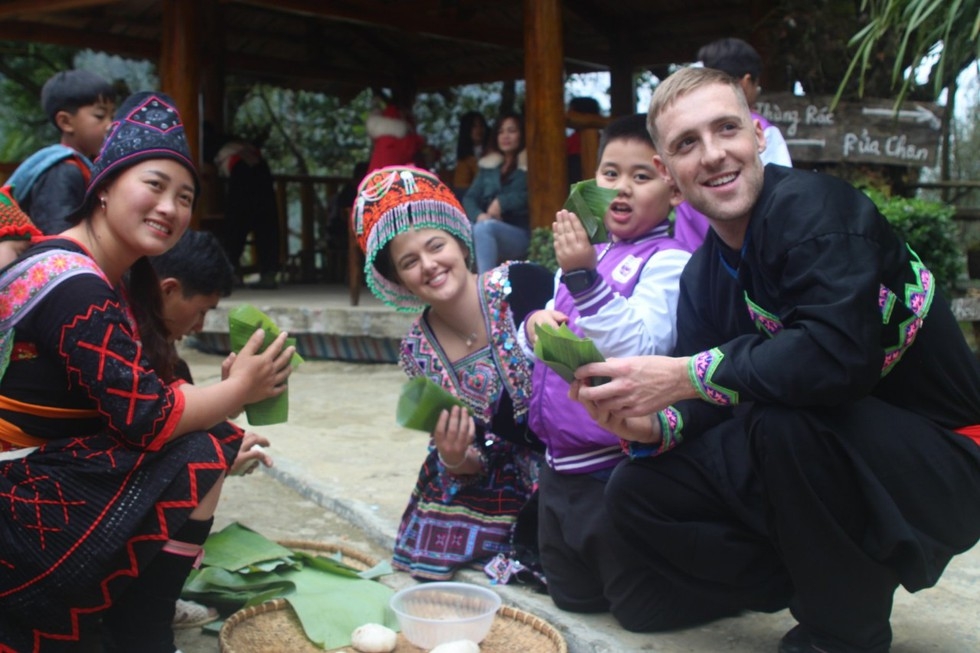 Sin Suoi Ho village, an ideal escape from daily hustle Foreign tourists taking photos at Sin Suoi Ho village.