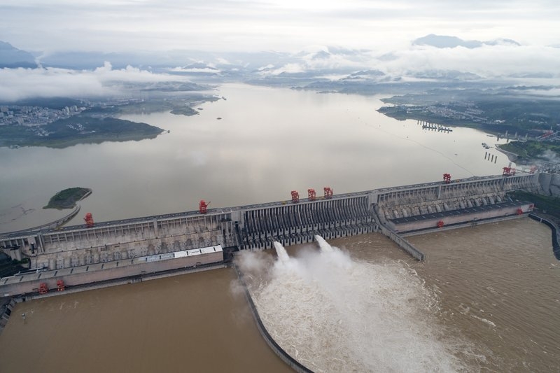 undefined Authorities in central China blasted a dam on Sunday to release surging waters behind it amid widespread flooding across the country