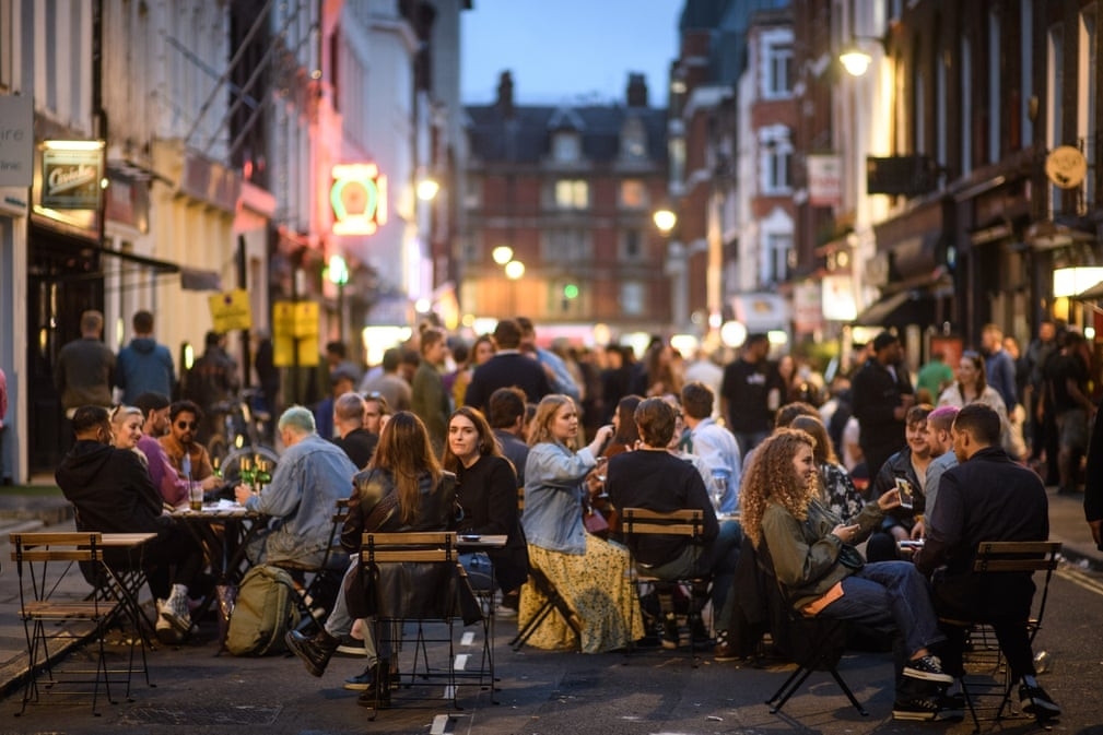Outdoor life in COVID-19 time Customer drinks beer outdoors in England