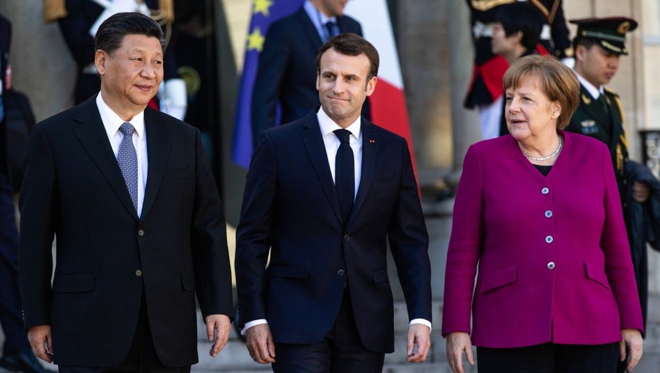 Germany warns of no business as usual between EU and China Presidents Xi and Macron together with Chancellor Merkel in Paris in 2019