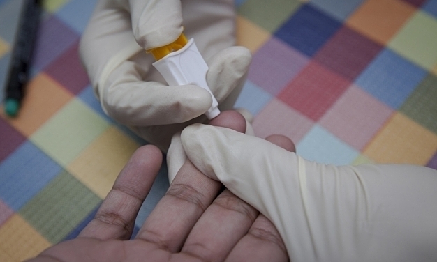 undefined A person receives an HIV test in Vietnam. Photo by UNAIDS.