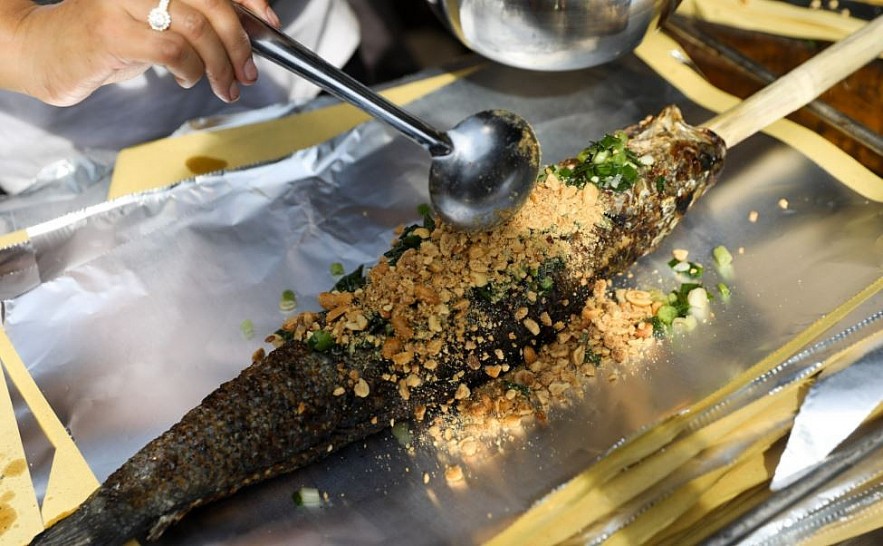Explaining Vietnamese Culture: Why People Buy Grilled Snakehead in God of Wealth's Day? Explaining Vietnamese Culture: Why People Buy Grilled Snakehead in God of Wealth's Day?