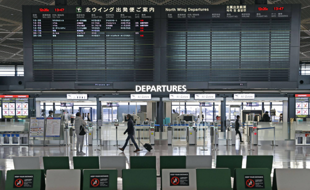 japan to halt new entry of foreign nationals over virus strain