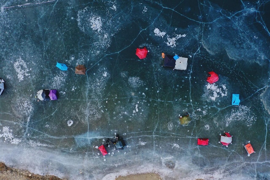 Vietnamese tourists camp on frozen river Vietnamese tourists camp on frozen river