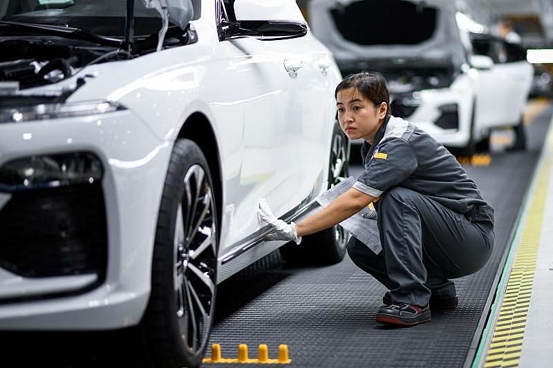 A worker operates the car assembly line at the new automobile plant of VinFast, Vietnam's first homegrown car manufacturer in Haiphong. A worker operates the car assembly line at the new automobile plant of VinFast, Vietnam's first homegrown car manufacturer in Haiphong.