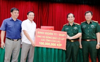 ຊຸມຊົນຊາວຫວຽດນາມ ອາໄສຢູ່ລາວ ຊ່ວຍເຫຼືອປະຊາຊົນທ້ອງຖິ່ນຜ່ານຜ່າ ໄພທຳມະຊາດ