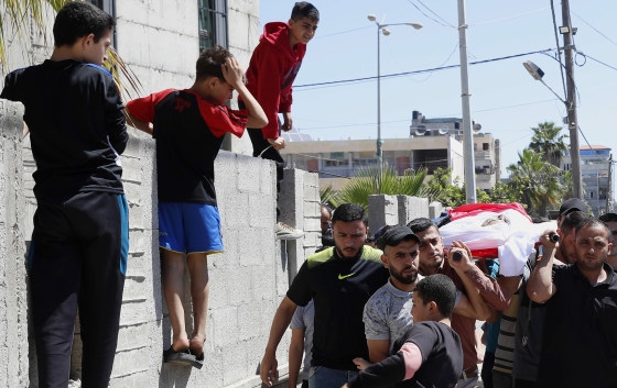 Mourners carry the body of Yousef Abu Hussein, an al-Aqsa radio reporter killed during an Israeli airstrike, during his funeral outside the main mosque in Gaza on Wednesday. Photo AFP Mourners carry the body of Yousef Abu Hussein, an al-Aqsa radio reporter killed during an Israeli airstrike, during his funeral outside the main mosque in Gaza on Wednesday. Photo AFP