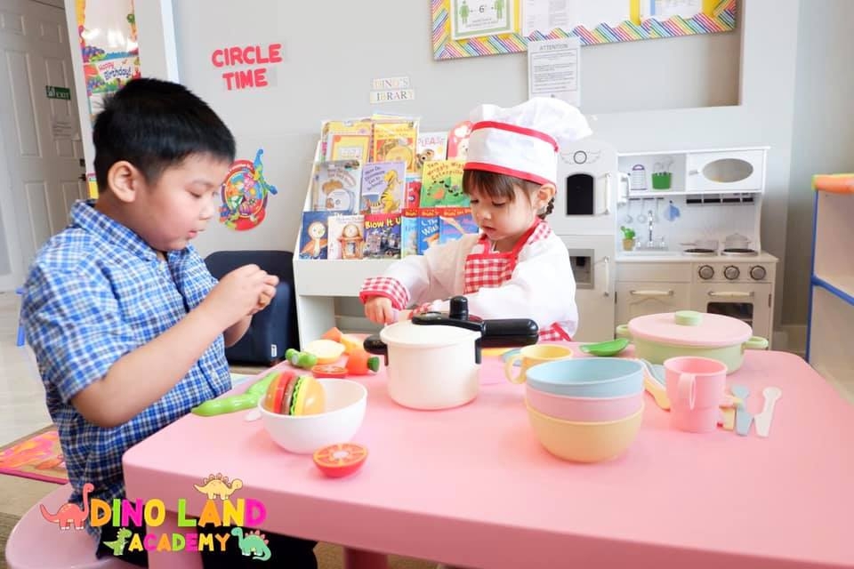 Children at Dino Land Academy role play as chefs. Photo courtesy of the academy Children at Dino Land Academy role play as chefs. Photo courtesy of the academy