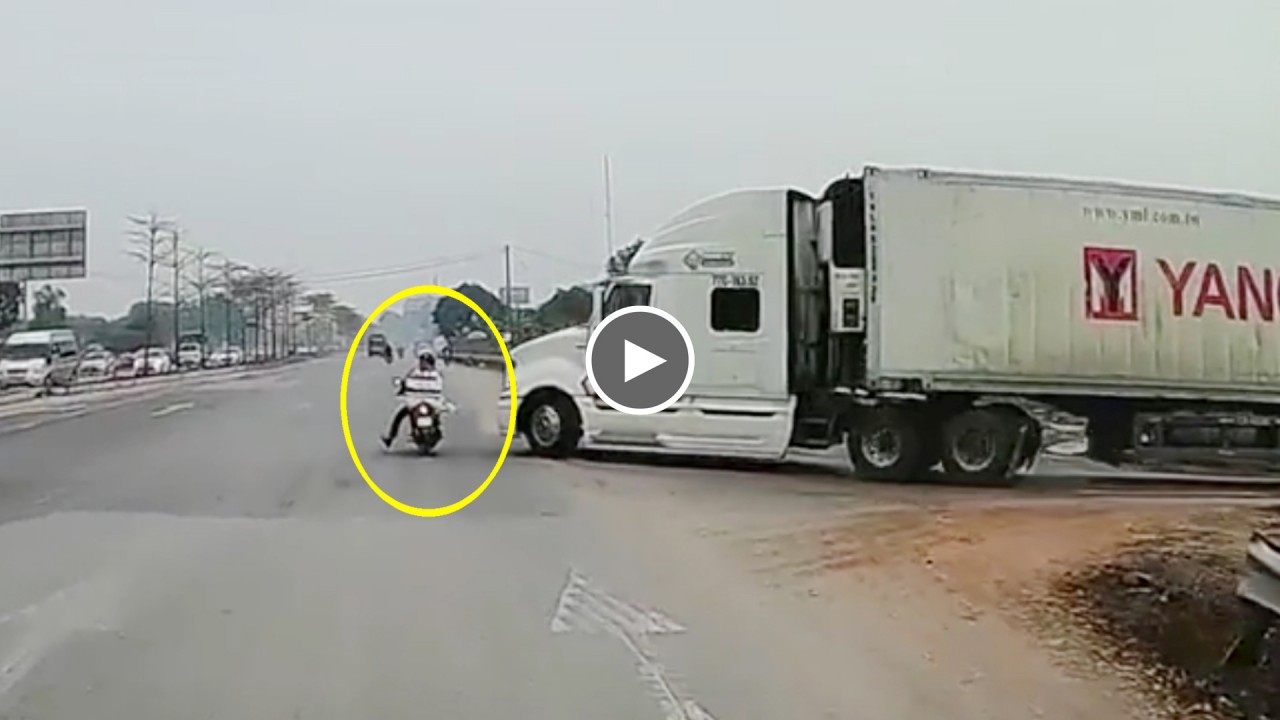 Thót tim màn thoạt chết trong gang tấc ngay trước đầu xe container Thót tim màn thoạt chết trong gang tấc ngay trước đầu xe container