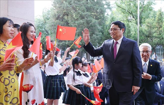 Thủ tướng Phạm Minh Chính gặp gỡ cộng đồng người Việt Nam tại Trung Quốc Chú thích ảnh