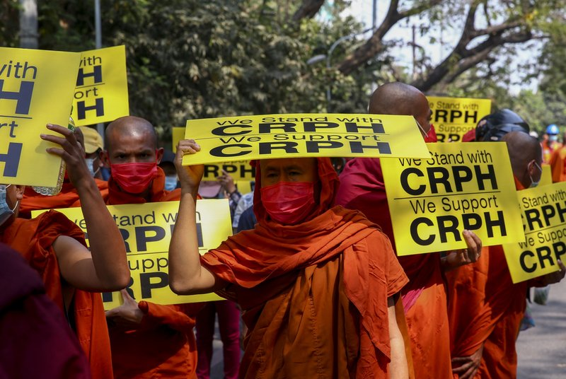 Buddhist monks lead an anti-coup protest march in Mandalay, Myanmar, Saturday, Feb. 27, 2021. Myanmar security forces cracked down on anti-coup protesters in the country's second-largest city Mandalay on Friday, injuring at least three people, two of whom were shot in the chest by rubber bullets and another who suffered a wound on his leg. Myanmar police cranks up pressure on protests, after calls for global action