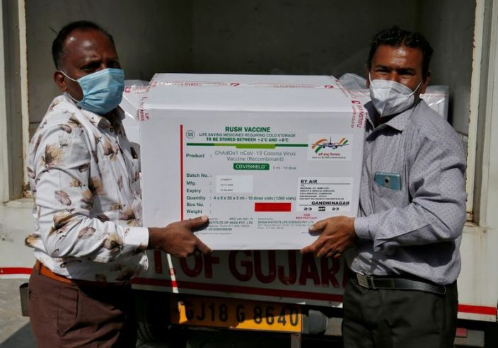 Officials unload boxes containing vials of COVISHIELD vaccine outside a vaccination storage centre in Ahmedabad (Photo: Reuters) 1356-syimg