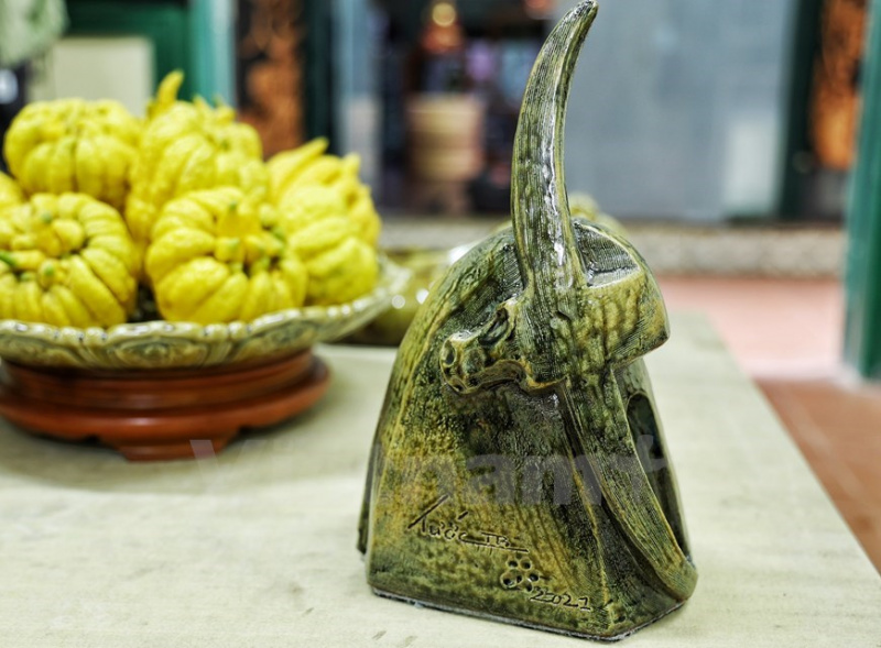 vietnamese artisan features traditional culture through ceramic buffalo sculptures