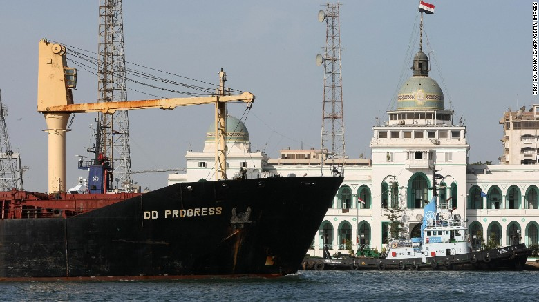 A cargo ship navigates in the Suez Canal, past the port authority building of Port Said, in 2008. The passageway hosts nearly 19,000 vessels each year. (Photo: CNN) 1410-150728124850-egypt-suez-canal-2008-exlarge-169