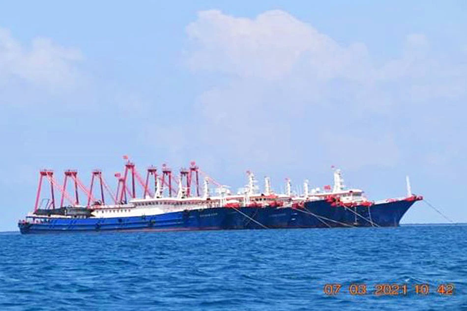 Some of the about 220 Chinese vessels reported by the Philippine Coast Guard, and believed to be manned by Chinese maritime militia personnel, are pictured at Whitsun Reef, South China Sea, March 7, 2021. Philippine Coast Guard/National Task Force-West Philippine Sea/Handout via Reuters/file Some of the about 220 Chinese vessels reported by the Philippine Coast Guard, and believed to be manned by Chinese maritime militia personnel, are pictured at Whitsun Reef, South China Sea, March 7, 2021. Philippine Coast Guard/National Task Force-West Philippine Sea/Handout via Reuters/file