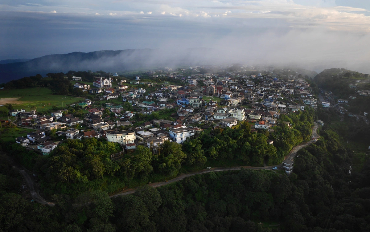 The village of Mawsynram, claiming to have the highest average rainfall on Earth. Perched atop a ridge in the Khasi Hills of India's northeast, the village receives 467 inches of rain per year - thirteen times that of Seattle. The heavy rainfall is due to summer air currents sweeping over the steaming floodplains of Bangladesh, gathering moisture as they move north. When the resulting clouds hit the steep hills of Meghalaya they are Shani Shingnapur in India - A village with no doors