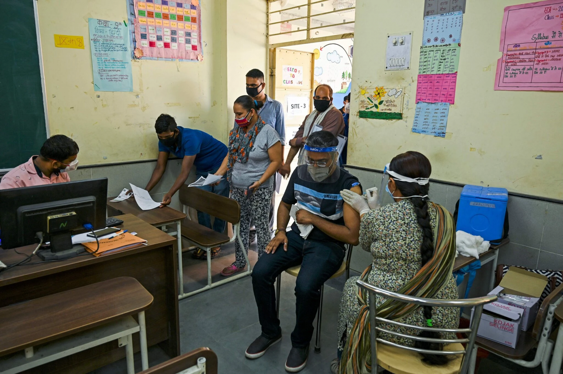 A vaccination center at a school in New Delhi on Wednesday. Credit...Tauseef Mustafa/Agence France-Presse — Getty Images A vaccination center at a school in New Delhi on Wednesday. Credit...Tauseef Mustafa/Agence France-Presse — Getty Images