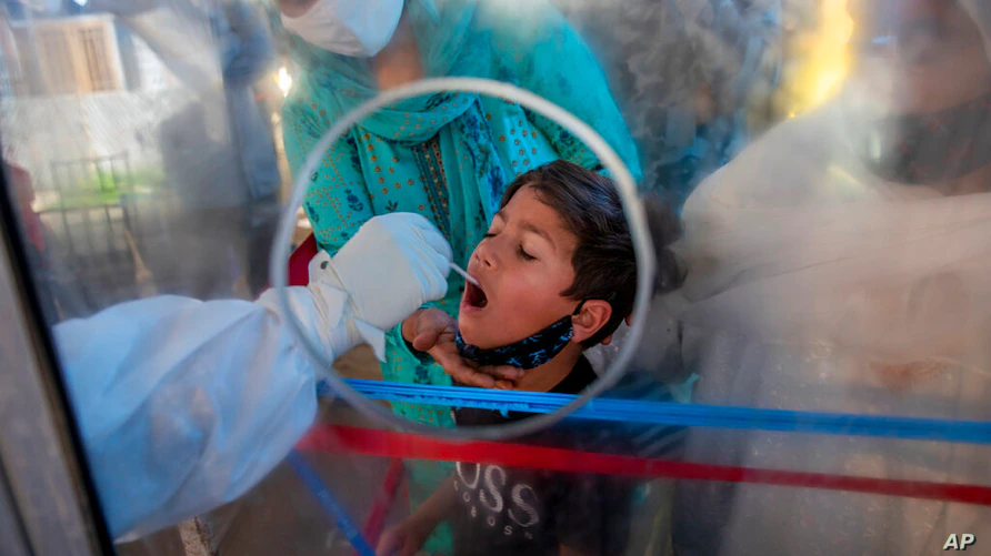 Print this page COVID-19 Pandemic More Contagious Variant Abets India’s COVID-19 Surge, WHO Says By VOA News May 08, 2021 09:37 PM A health worker takes a mouth swab sample of a Kashmiri boy to test for COVID-19 in Srinagar, Indian controlled Kashmir,… A health worker takes a swab from a Kashmiri boy to test for COVID-19 in Srinagar, Indian-controlled Kashmir, May 8, 2021. Infections have swelled in India since February; more contagious variants and permissive decisions on gatherings are blamed. Print this page COVID-19 Pandemic More Contagious Variant Abets India’s COVID-19 Surge, WHO Says By VOA News May 08, 2021 09:37 PM A health worker takes a mouth swab sample of a Kashmiri boy to test for COVID-19 in Srinagar, Indian controlled Kashmir,… A health worker takes a swab from a Kashmiri boy to test for COVID-19 in Srinagar, Indian-controlled Kashmir, May 8, 2021. Infections have swelled in India since February; more contagious variants and permissive decisions on gatherings are blamed.