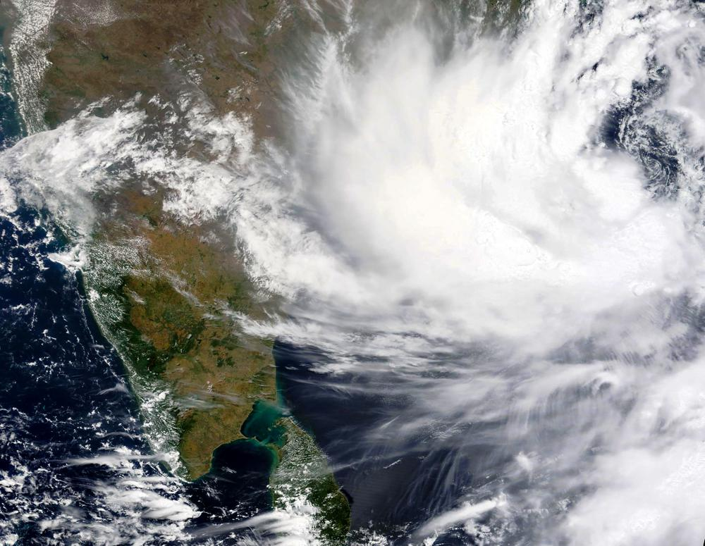 This Monday, May, 24, 2021, satellite image provided by NASA shows Cyclone Yaas approaching India's eastern coast. Yaas is expected to make landfall on Wednesday, May 26, 2021, and could pack sustained winds of up to 165 kilometers per hour (102 miles per hour), the India Meteorological Department said. It said the storm was forecast to hit the eastern states of West Bengal and Odisha, just days after a powerful storm battered the country's western coast and killed at least 140 people. (NASA Worldview, Earth Observing System Data and Information System (EOSDIS) via AP) This Monday, May, 24, 2021, satellite image provided by NASA shows Cyclone Yaas approaching India's eastern coast. Yaas is expected to make landfall on Wednesday, May 26, 2021, and could pack sustained winds of up to 165 kilometers per hour (102 miles per hour), the India Meteorological Department said. It said the storm was forecast to hit the eastern states of West Bengal and Odisha, just days after a powerful storm battered the country's western coast and killed at least 140 people. (NASA Worldview, Earth Observing System Data and Information System (EOSDIS) via AP)