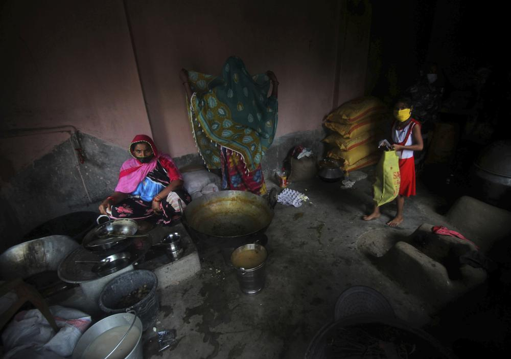 Village women who have taken refuge at a cyclone shelter prepare a meal in Balasore district in Odisha, India, Tuesday, May 25, 2021. Tens of thousands of people were evacuated Tuesday in low-lying areas of two Indian states and moved to cyclone shelters to escape a powerful storm barreling toward the eastern coast. (AP Photo) Village women who have taken refuge at a cyclone shelter prepare a meal in Balasore district in Odisha, India, Tuesday, May 25, 2021. Tens of thousands of people were evacuated Tuesday in low-lying areas of two Indian states and moved to cyclone shelters to escape a powerful storm barreling toward the eastern coast. (AP Photo)