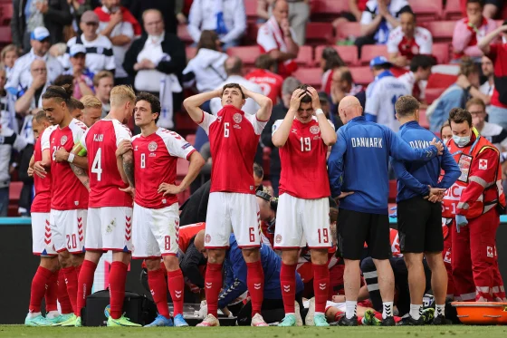 Denmark's players react as paramedics attend to Denmark's midfielder Christian Eriksen on Saturday. Friedemann Vogel / AFP - Getty Images Denmark's players react as paramedics attend to Denmark's midfielder Christian Eriksen on Saturday. Friedemann Vogel / AFP - Getty Images