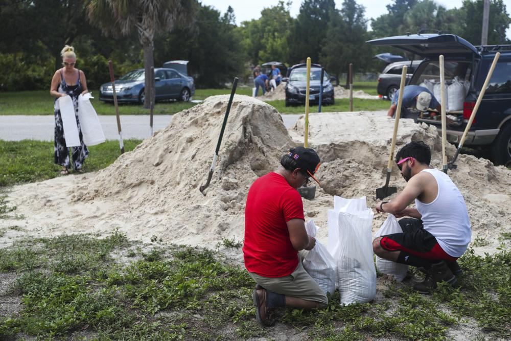 People fill sandbags to prep for storm Elsa at Walsingham Park, Monday, July 5, 2021 in Seminole, Fla. (Arielle Bader /Tampa Bay Times via AP) People fill sandbags to prep for storm Elsa at Walsingham Park, Monday, July 5, 2021 in Seminole, Fla. (Arielle Bader /Tampa Bay Times via AP)