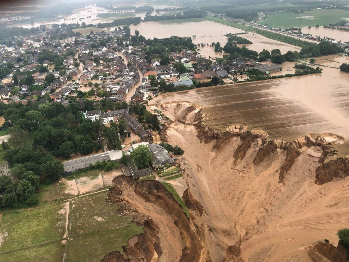 Flooding has led to the collapse of an entire field in Rhein-Erft-Kreis, a district in western Germany. Officials have said a warming climate is at least partially to blame for floods. Rhein-Erft-Kreis District/Storyful Flooding has led to the collapse of an entire field in Rhein-Erft-Kreis, a district in western Germany. Officials have said a warming climate is at least partially to blame for floods. Rhein-Erft-Kreis District/Storyful
