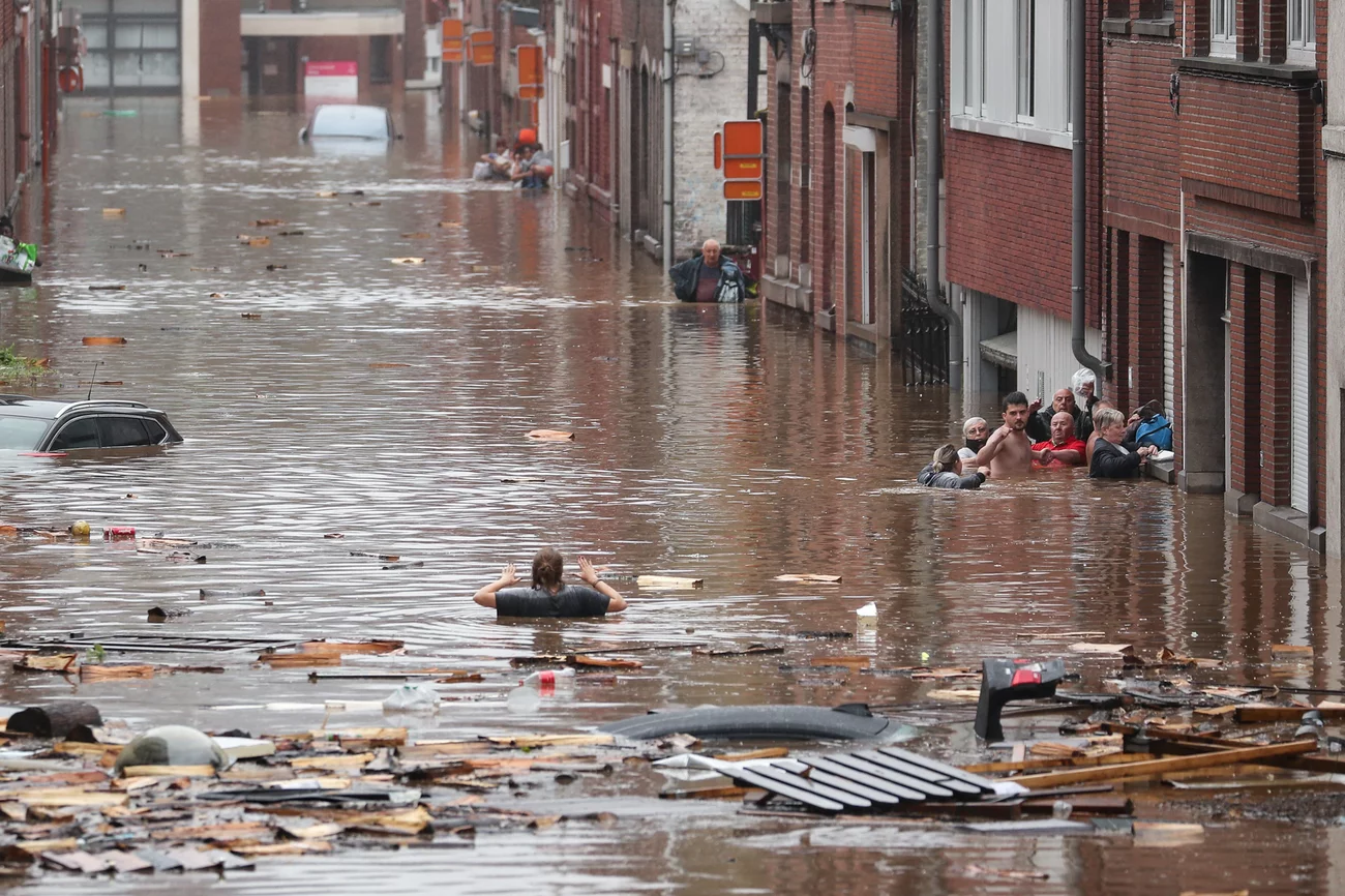 A woman tries to move in a flooded street following heavy rains Thursday in Liège, Belgium. Bruno Fahy/Belga/AFP via Getty Images A woman tries to move in a flooded street following heavy rains Thursday in Liège, Belgium. Bruno Fahy/Belga/AFP via Getty Images