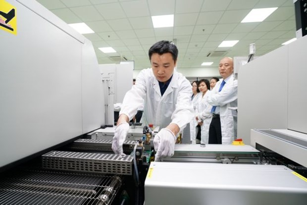 An engineer monitors a production line at a circuit board factory at the Da Nang IT Park. The central city's IZs and IPs have still lured investment in spite of the coronavirus outbreak. (Photo courtesy of Trung Nam Group) An engineer monitors a production line at a circuit board factory at the Da Nang IT Park. The central city's IZs and IPs have still lured investment in spite of the coronavirus outbreak. (Photo courtesy of Trung Nam Group)