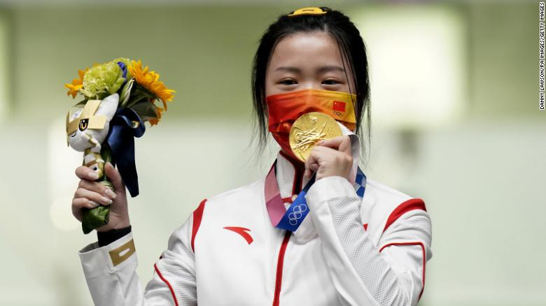 China's Yang Qian celebrates with her gold medal after winning the 10m Air Rifle Women's Final on the first day of the Tokyo 2020 Olympic Games. Photo: CNN China's Yang Qian celebrates with her gold medal after winning the 10m Air Rifle Women's Final on the first day of the Tokyo 2020 Olympic Games. Photo: CNN