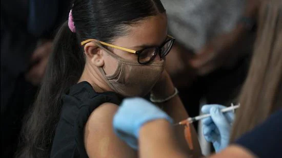 Giret Madina, 14, gets Pfizer’s Covid-19 vaccine at Lehman High School on July 27, 2021, in New York, US. (AP) Giret Madina, 14, gets Pfizer’s Covid-19 vaccine at Lehman High School on July 27, 2021, in New York, US. (AP)