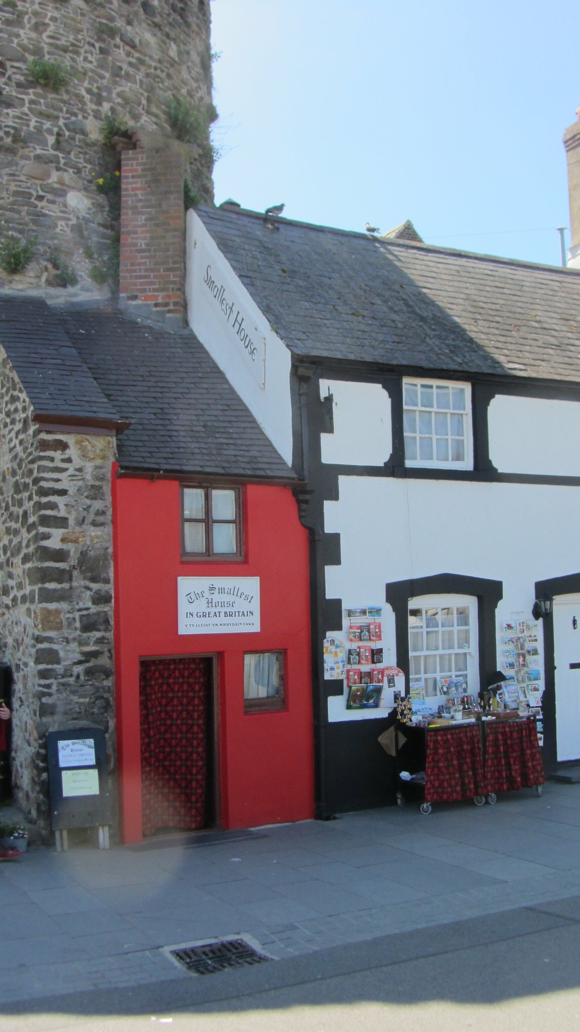 The petit red house becomes a highlight of the street. Photo: Unusual Places The petit red house becomes a highlight of the street. Photo: Unusual Places
