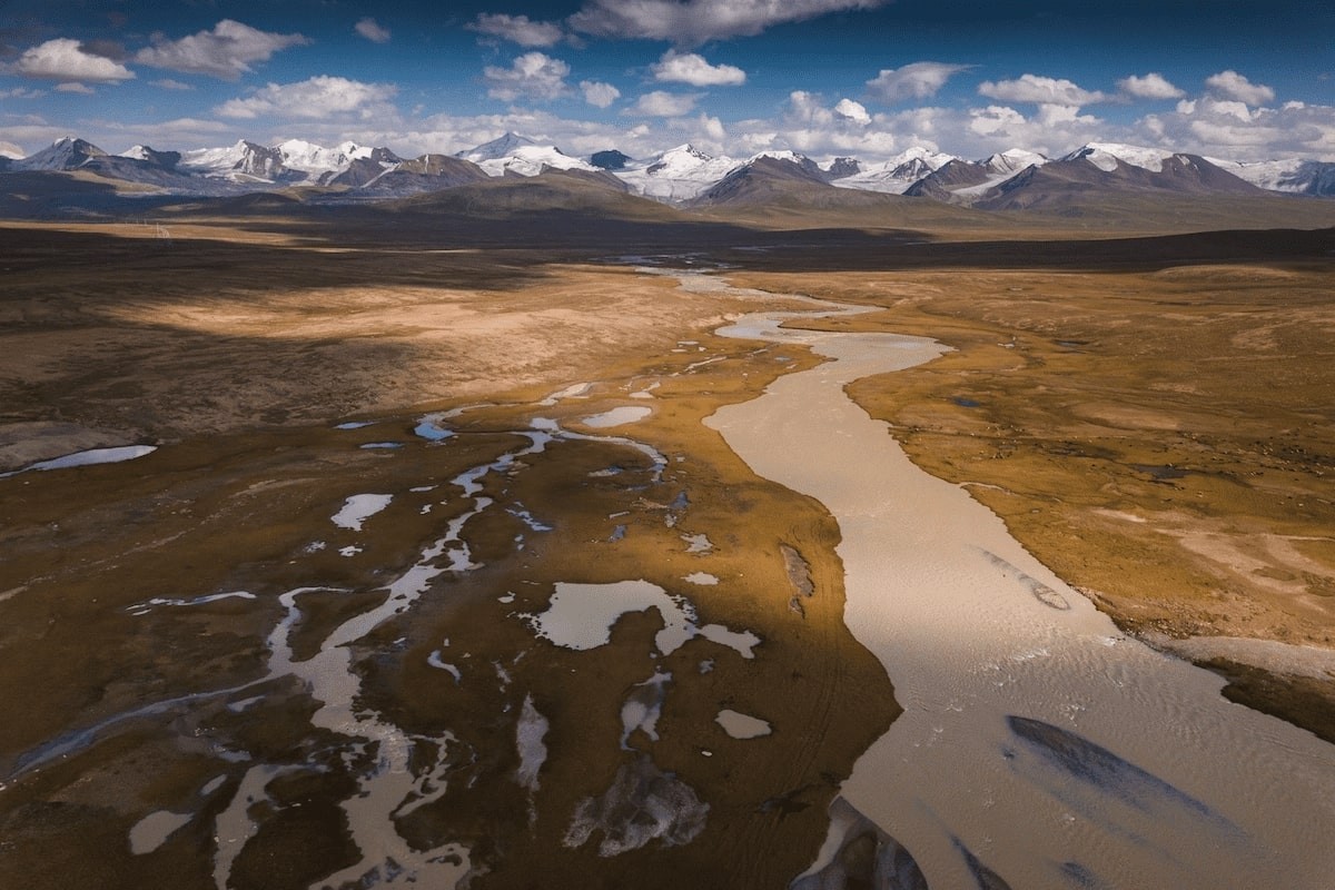 A wide open valley with glacial rivers coming from the mountains protecting the valley. These mountains are often 5000m+ (16400ft+). This is a shot of the Barskoon Valley. It took a 4000m (13000ft) road pass to get here. Photo: Albert Dros A wide open valley with glacial rivers coming from the mountains protecting the valley. These mountains are often 5000m+ (16400ft+). This is a shot of the Barskoon Valley. It took a 4000m (13000ft) road pass to get here. Photo: Albert Dros
