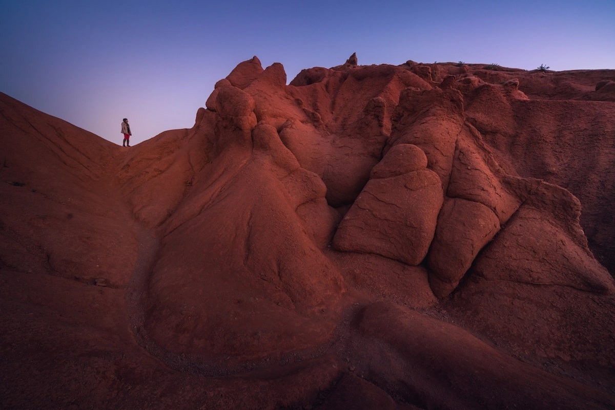 Twilight before the sun comes up. Standing at one of the crazy canyons in Kyrgyzstan that look like they’re coming straight from the moon. Photo: Albert Dros Twilight before the sun comes up. Standing at one of the crazy canyons in Kyrgyzstan that look like they’re coming straight from the moon. Photo: Albert Dros