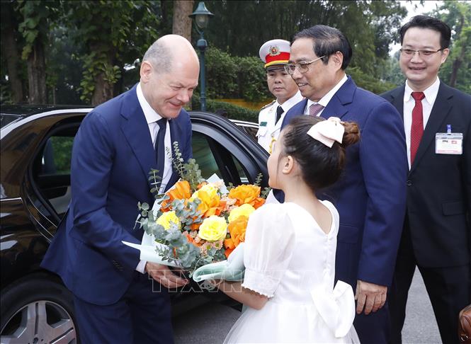 Lễ đón Thủ tướng Cộng hòa Liên bang Đức thăm chính thức Việt Nam Chú thích ảnh