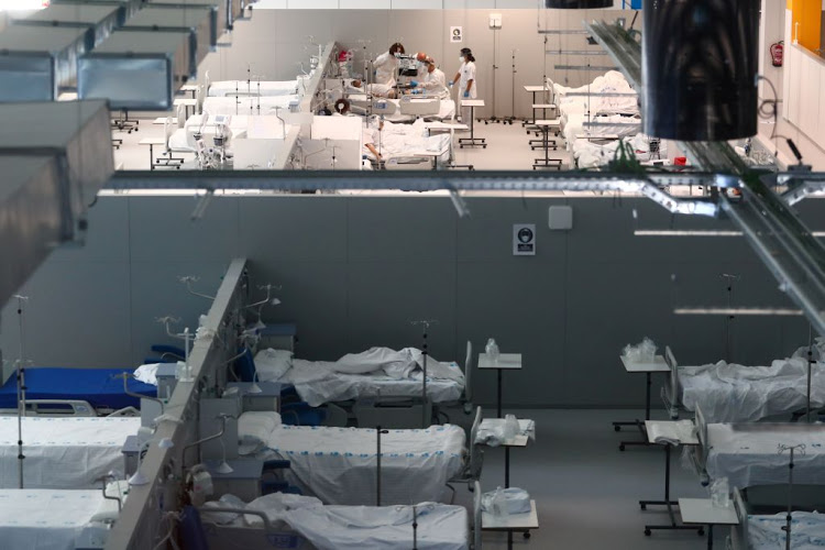 Doctors treat Covid-19 patients at Enfermera Isabel Zendal hospital in Madrid, Spain, on January 11 2021. Photo: Reuters 5718 patients