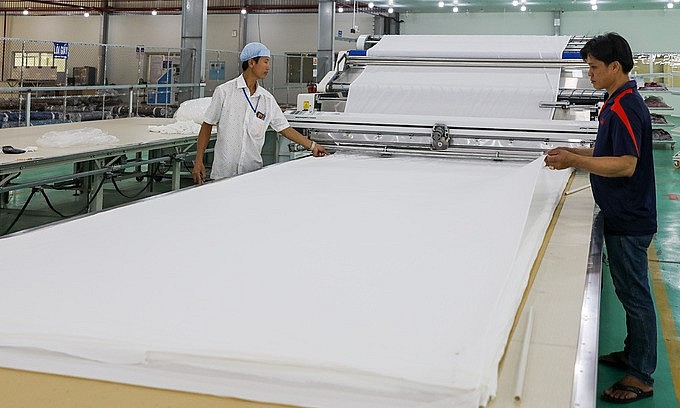 Workers at a textile factory in Vietnam's southern province of Long An, February 2020. Textile is on the list of industries expected to benefit from the new free trade deal between Vietnam and the U.K. Photo by VnExpress Workers at a textile factory in Vietnam's southern province of Long An, February 2020. Textile is on the list of industries expected to benefit from the new free trade deal between Vietnam and the U.K. Photo by VnExpress