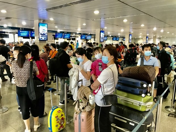 Passengers at the domestic terminal at Tan Son Nhat International Airport in HCM City ahead of the Lunar New Year holiday. 2242 tan son nhat airport