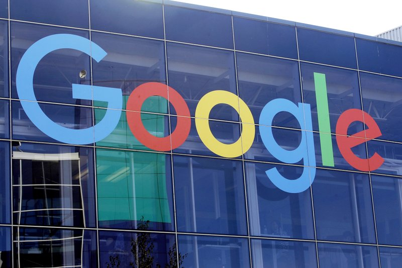 This Sept. 24, 2019, file photo shows a sign on a Google building at their campus in Mountain View, Calif. Google was quickly negotiating generous deals with big and small Australian media companies to pay for news as the Parliament considers forcing digital giants into such remuneration agreements, a minister said on Wednesday, Feb. 17, 2021. (AP Photo/Jeff Chiu, File) 0225-google