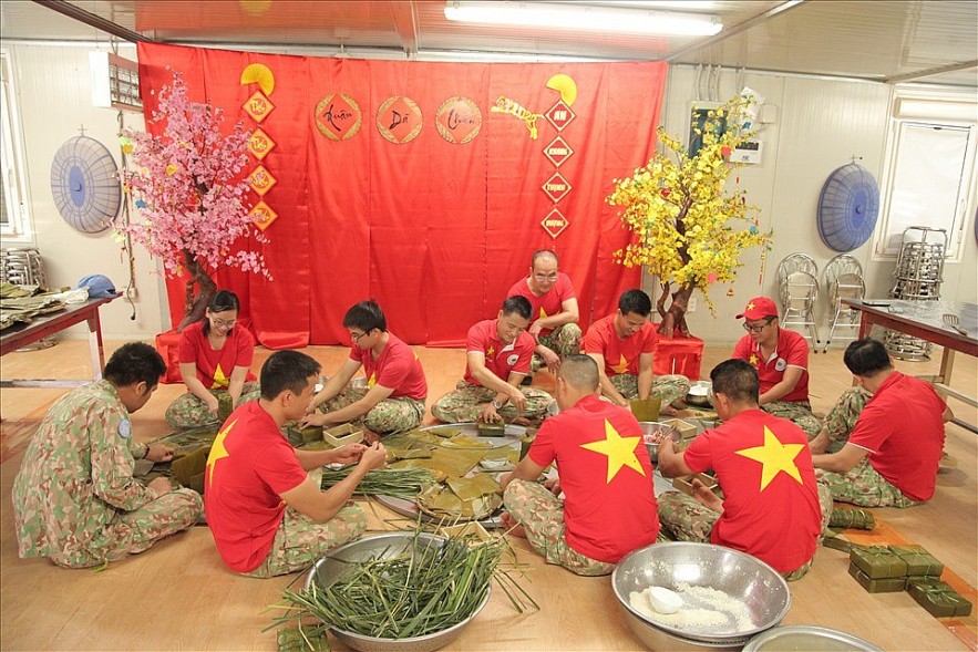Banh Chung (glutinous rice cake) which is indispensable during Tet is wrapped with banana leaves taken from capital Juba, and pork from pigs raised by the Vietnamese officers and employees locally. Banh Chung (glutinous rice cake) which is indispensable during Tet is wrapped with banana leaves taken from capital Juba, and pork from pigs raised by the Vietnamese officers and employees locally.