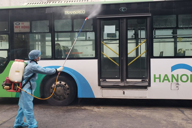 Spraying disinfectant on buses. 2239-bus