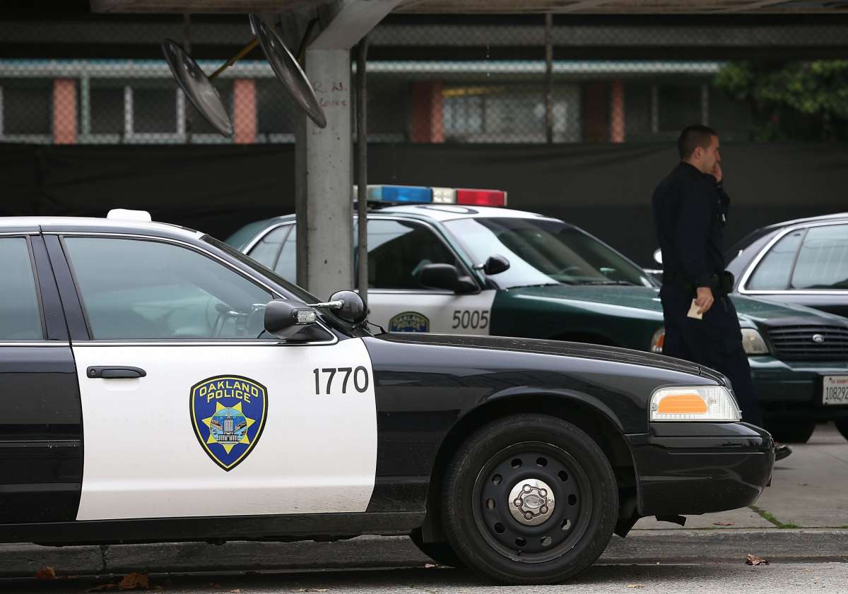 An Oakland Police officer walks by patrol cars at the Oakland Police headquarters on December 6, 2012 in Oakland, California. Justin Sullivan/Getty Images 3822-rob