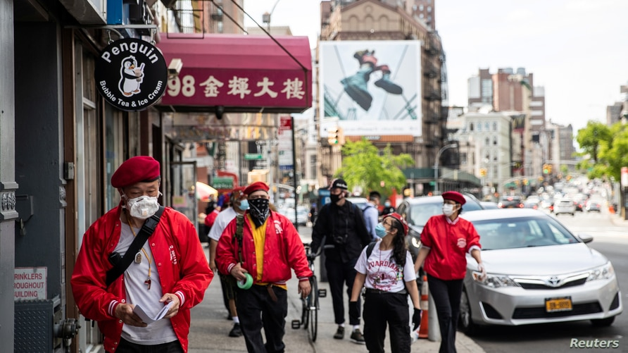 Wally Ng, a member of the Guardian Angels, patrols with other members in Chinatown in New York City, New York, U.S., May 16, 2020. Photo by Reuters. 3942-asian
