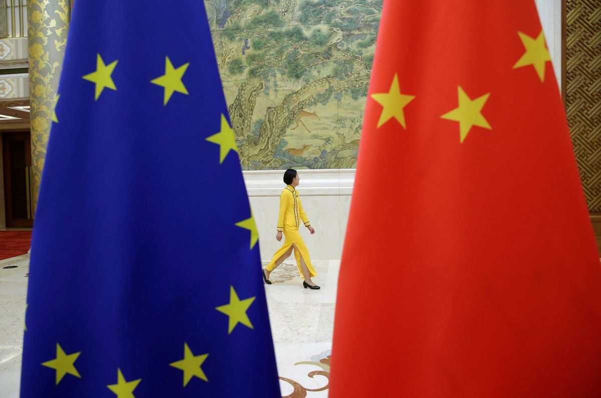 An attendant walks past EU and China flags ahead of the EU-China High-level Economic Dialogue at Diaoyutai State Guesthouse in Beijing, China June 25, 2018. Photo by Reuters/Jason Lee. An attendant walks past EU and China flags ahead of the EU-China High-level Economic Dialogue at Diaoyutai State Guesthouse in Beijing, China June 25, 2018. Photo by Reuters/Jason Lee.