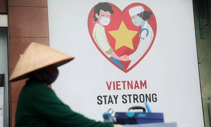 A banner advocating Vietnam's Covid-19 fight in HCMC, March 2020. Photo by VnExpress/Huu Khoa A banner advocating Vietnam's Covid-19 fight in HCMC, March 2020. Photo by VnExpress/Huu Khoa