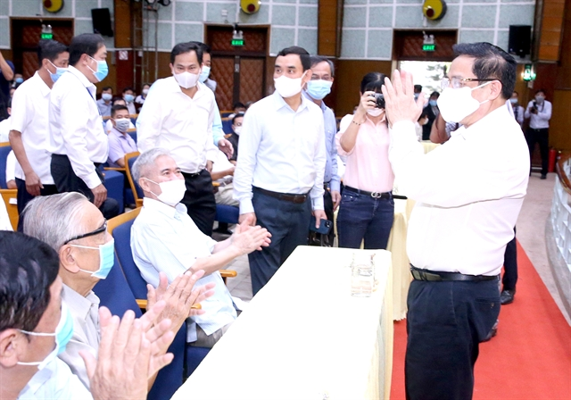 Prime Minister Phạm Minh Chính (right) meets voters in the Mekong Delta's Cần Thơ City on Saturday. — VNA/VNS Photo Prime Minister Phạm Minh Chính (right) meets voters in the Mekong Delta's Cần Thơ City on Saturday. — VNA/VNS Photo