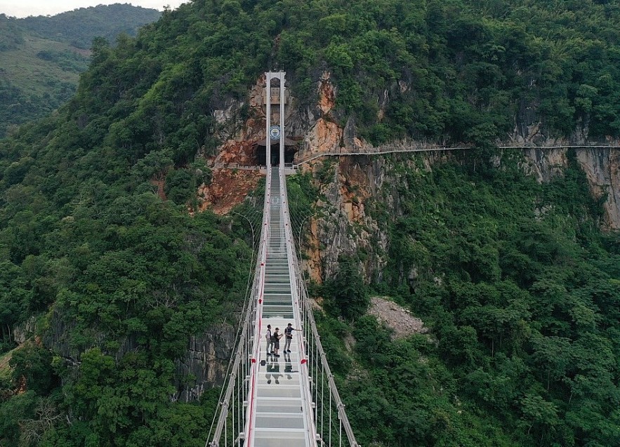 The Bach Long pedestrian bridge – whose name translates to “white dragon” — is 632m long — and is 150m above a huge jungle. The Bach Long pedestrian bridge – whose name translates to “white dragon” — is 632m long — and is 150m above a huge jungle.